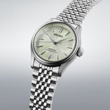 SEIKO PRESAGE HCC002J1 watch with stainless steel case and black leather strap, showcasing elegant design and analog dial.