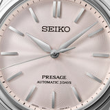 Seiko Presage HCC003J1 wristwatch with stainless steel band and white dial, showcasing elegant timepiece design.