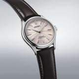 SEIKO Presage watch HCC003J1 with stainless steel case and leather strap, featuring a white dial with gold-tone hands and markers.