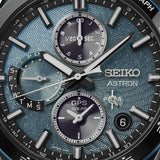 Seiko Astron SSH187J1 solar GPS watch with stainless steel band and black dial, showing time and world time display.